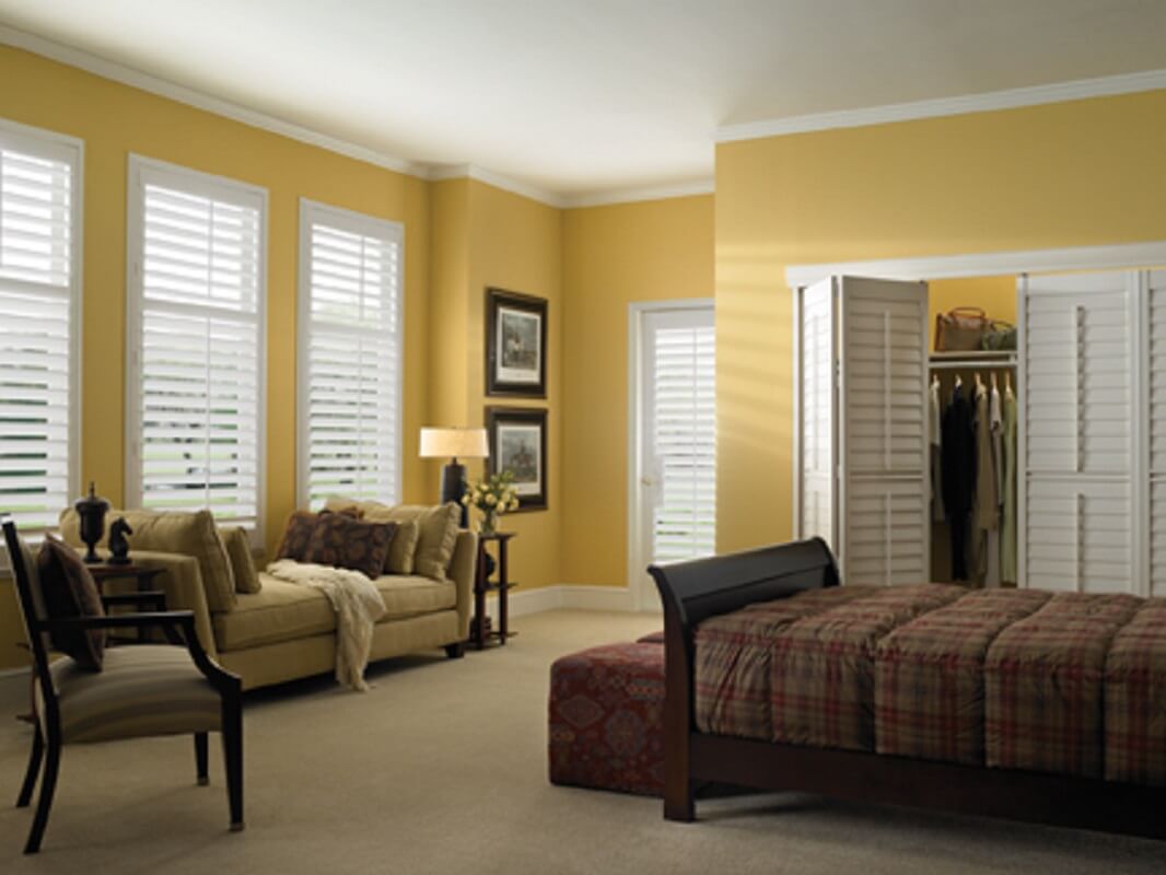 Faux wood shutters installed in Spring TX by Shutters & Blinds of The Woodlands